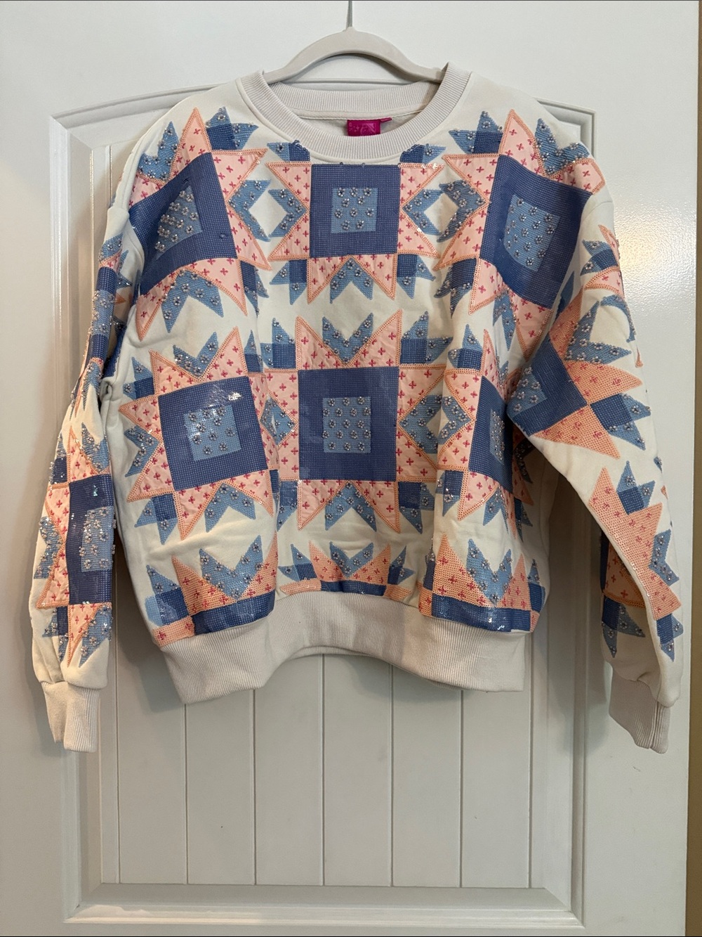 QUEEN OF SPARKLES Cream Crewneck Sweater with Blue and Pink Star Quilt Motif